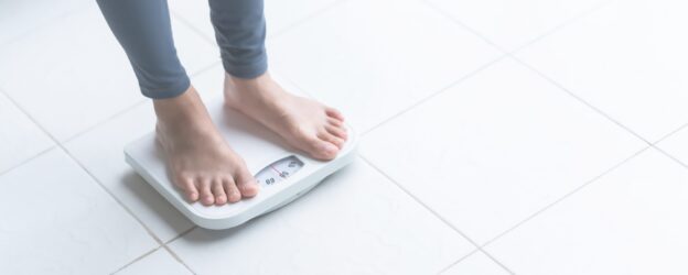 woman on a set of scales